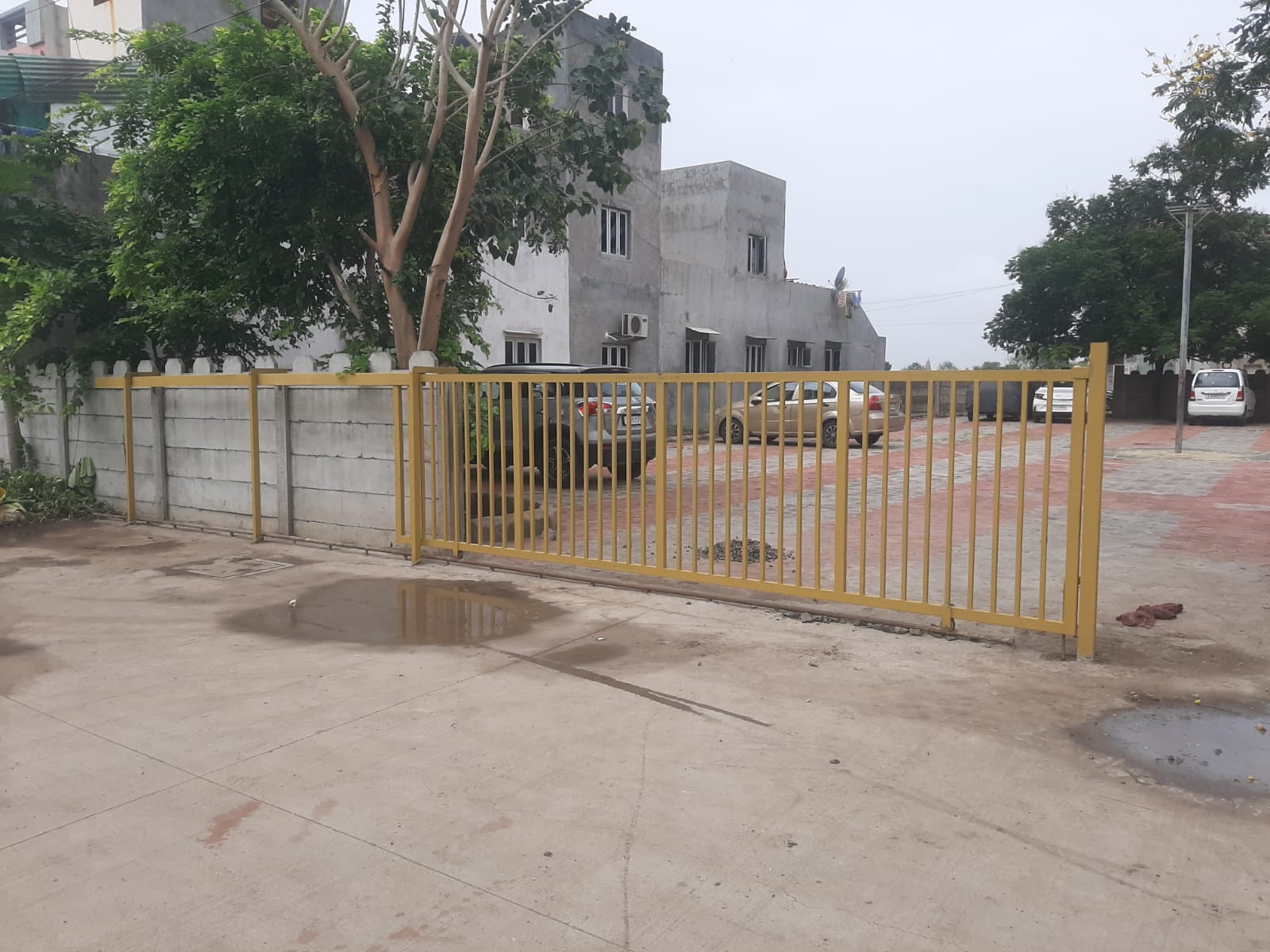 Gurukrupa yellow residential compound gate